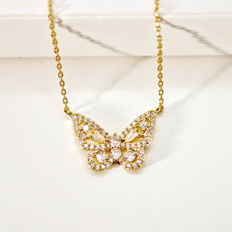Radiant Butterfly Charm Necklace – Elegance in Gold